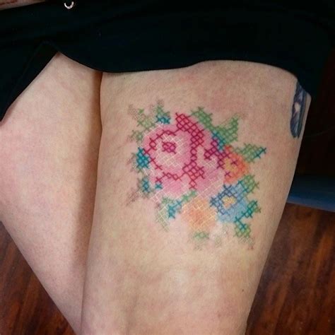 Cross Stitch Flower Tattoo On Girl Right Thigh By Eva Krbdk