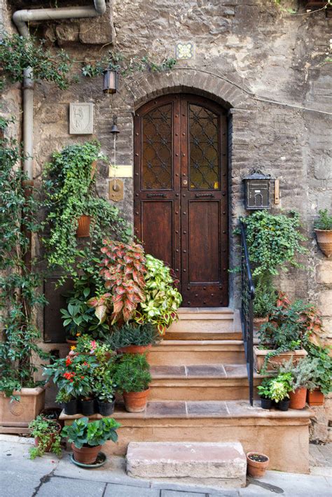 Idyllic house front door with flower pots in alcudia on majorca, spain balearic islands. 59 Front Door Flower and Plant Ideas