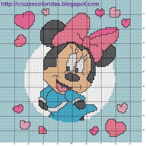 A Cross Stitch Pattern With Minnie Mouse In The Center And Hearts