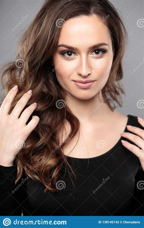 Brunette Girl With Healthy Curly Hair And Natural Make Up Beautiful Model Woman With Wavy