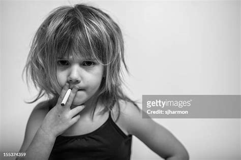 Girl Smoking Cigarette Photos And Premium High Res Pictures Getty Images