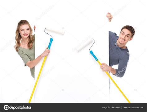 Couple Holding Paint Rollers — Stock Photo © Dmitrypoch 150426868