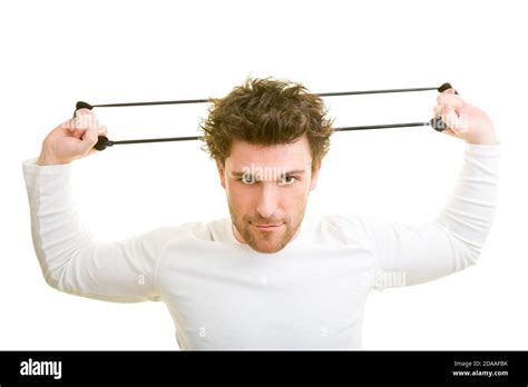 Young Man Trains With Expander Stock Photo Alamy