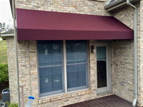 A colorful canvas awning can provide an attractive complement to your home's exterior. Canvas Awnings | Evergreen Awnings