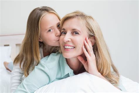 Cute Girl Kissing Her Smiling Mother Stock Image Image Of Cheerful