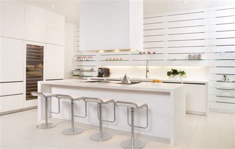 With white chairs, cabinets and columns, bright white kitchen remodel. 30 Modern White Kitchens That Exemplify Refinement