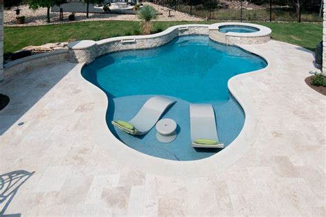 Travertine Deck With Lueder Coping Surrounding A Freeform Pool Dream