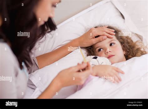 Mother Taking Care Of Her Sick Babe Stock Photo Alamy