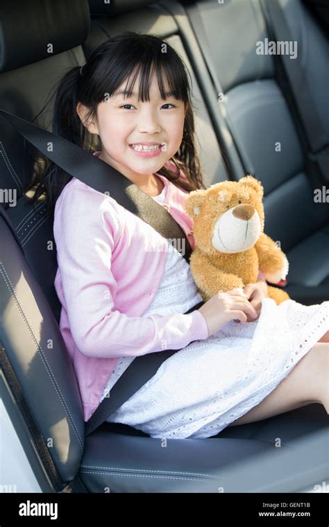 Cute Little Chinese Girl Sitting In Car Back Seat Stock Photo Alamy
