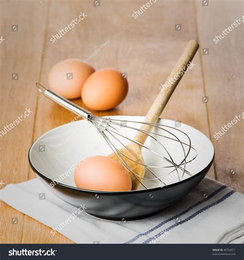 Baking Equipment With Mixing Bowl Wooden Spoon And Whisk Stock Photo