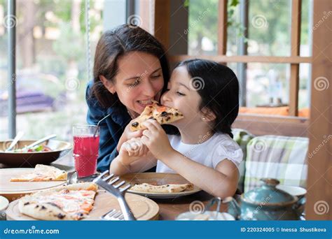 Mom And Daughter Eat Pizza In A Cafe Restaurant Stock Image Image Of