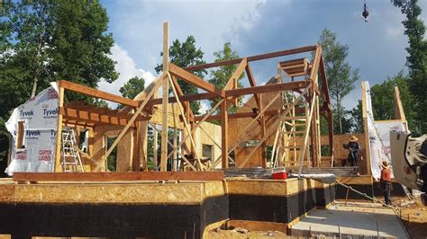 From Heavy Timber Truss Frame Llc This Timber Frame Sip Home In