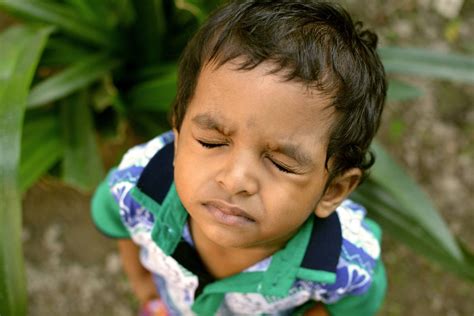Close Up Shot Of A Little Boy Closing His Eyes · Free Stock Photo