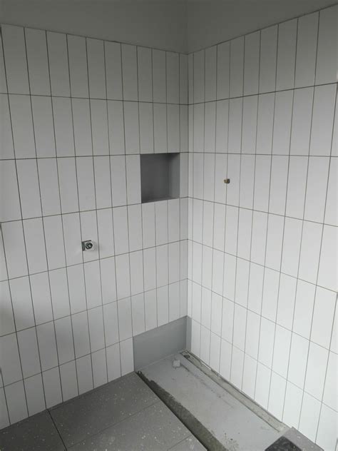 Bathroom tiles vs bathroom panels: Bathroom wall tiles 300mm x 100mm gloss white in vertical ...