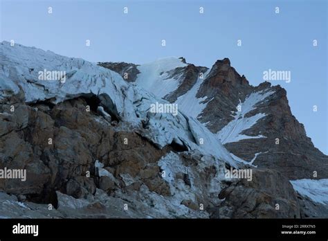 Gran Paradiso Mountain Peak Glacier With Crevasses Detail And Blue Sky At Blue Hour
