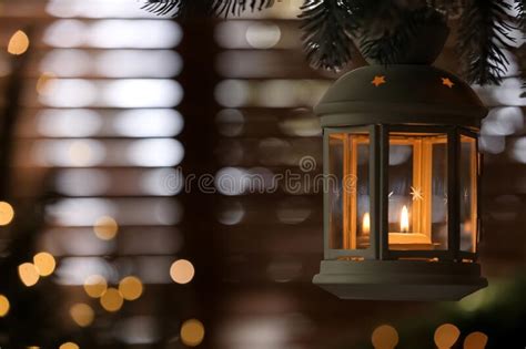 Beautiful Christmas Lantern With Burning Candle Hanging On Fir Tree