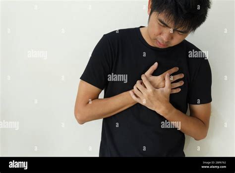 The Man Suffering From Chest Pain Heart Attack Stock Photo Alamy