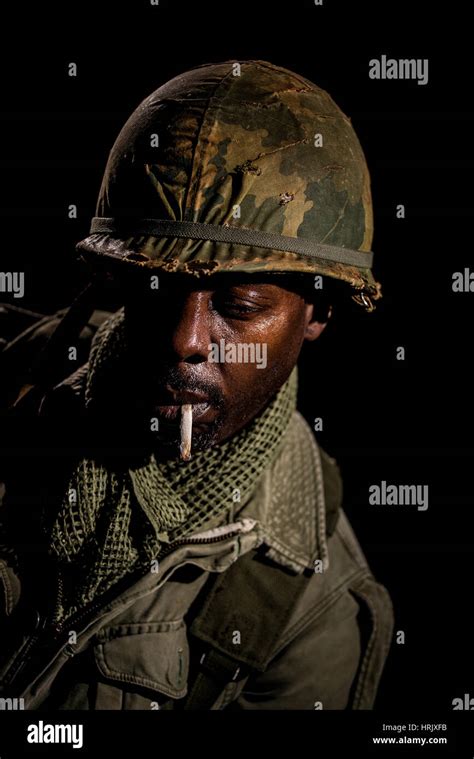 portrait of african american soldier from the vietnam war period against a black background