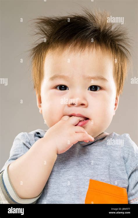 Asia Baby Sucking Finger Into Mouth Stock Photo Alamy