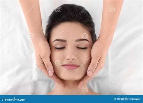 Young Woman Receiving Face Massage In Spa Salon Top View Stock Image Image Of Luxury Resort