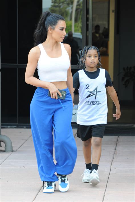 kim kardashian s tiny waist drowns in baggy pants and crop top as star avoids ex kanye west at