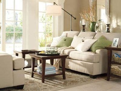 Living rooms in yellow and green are incredibly popular, and each color seems to bring the very best out of the other. green and beige living room. Benjamin Moore-Bleeker beige | Family room decorating, Pottery barn ...