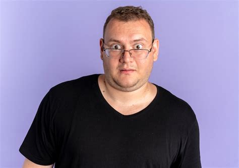 Free Photo Overweight Man In Glasses Wearing Black T Shirt Looking At