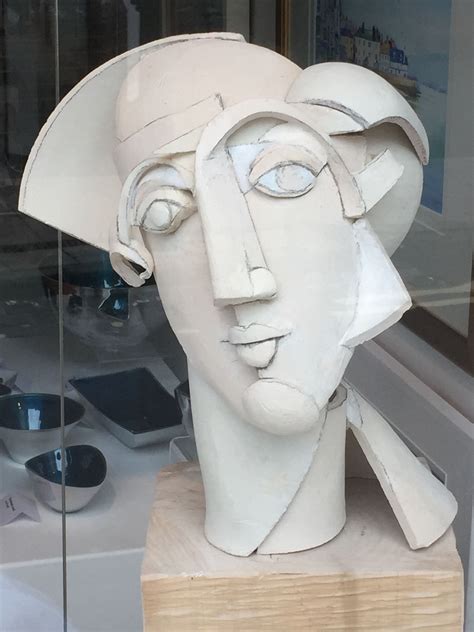 Sculpture Of A Mans Head In A Glass Case
