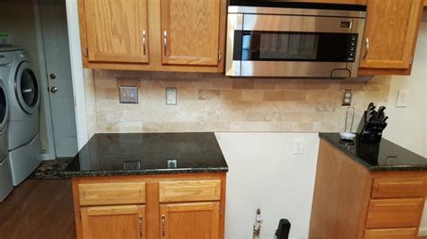 Uba tuba granite, also called verde labrador, green labrador, or butterfly granite, is typically such a dark green color it appears black. Uba Tuba Granite Countertops - Traditional - Kitchen - Charlotte - by Fireplace & Granite ...