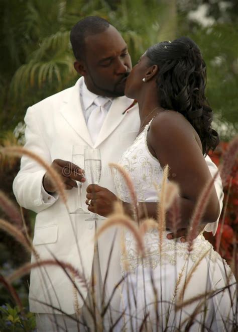 Bride And Groom An African American Wedding Couple Kissing And