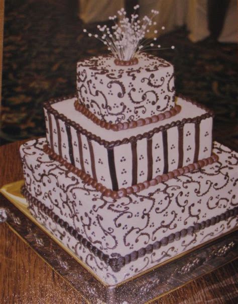 Find over 100+ of the best free wedding cake images. Brown buttercream scrollwork wedding cake - cake by ...