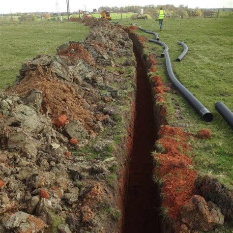Trench dig out for new electric supply across field