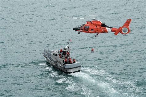 An Mh 65 Dolphin Helicopter Crew From Coast Guard Air Picryl Public