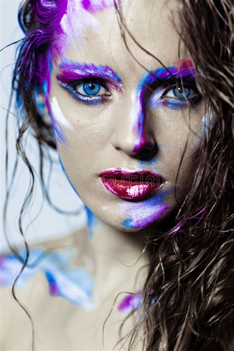 Creative Art Makeup Of A Young Girl With Blue Eyes Stock