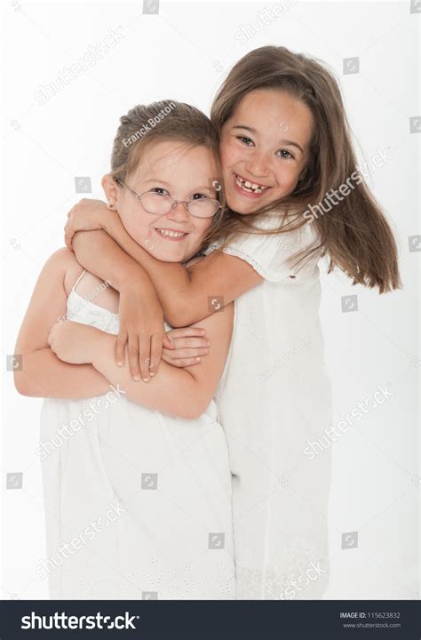 Two Little Sisters Hugging Stock Photo 115623832 Shutterstock