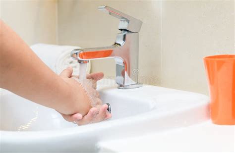 Washing Hands Child Rinsing Soap With Running Water At Sink Stock Image