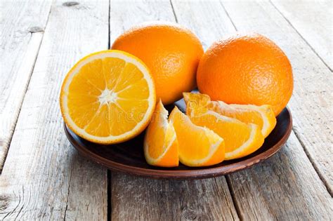 Plate With Oranges On Wooden Table Stock Image Image Of Oranges