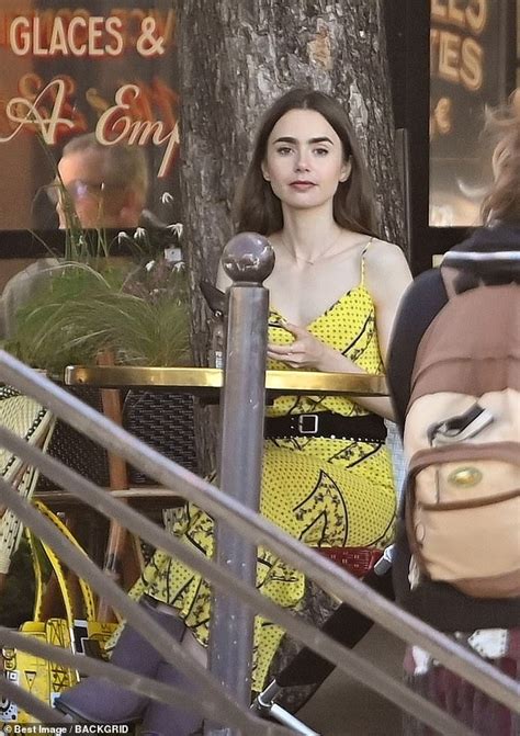 Lily Collins Oozes Chic In A Patterned Yellow Dress As She Continues