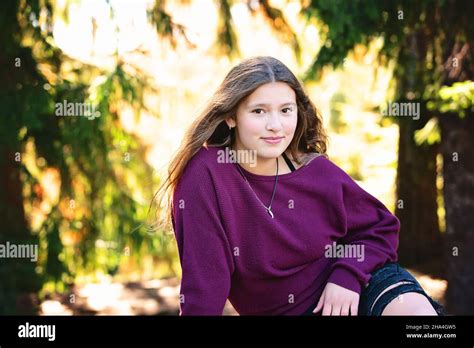 Beautiful Smiling Tween Girl Outdoors In Fall Colors Stock Photo Alamy