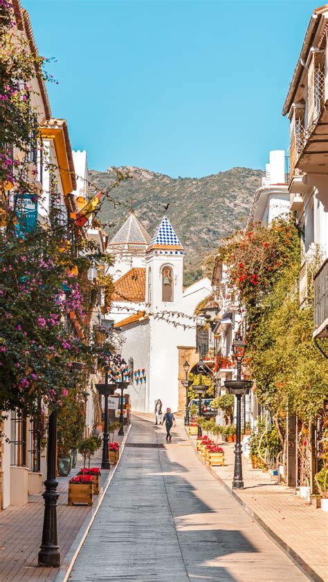 One Of The Main Streets Of Marbella Old Town Full Of Plants With A