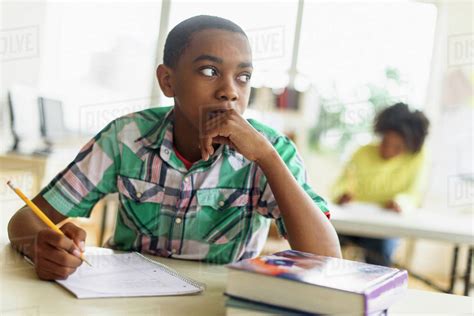 Black Student Thinking In Classroom Stock Photo Dissolve