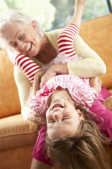 Grandmother And Granddaughter Having Fun On Sofa Stock Image Image Of Lying Sixties 54971359