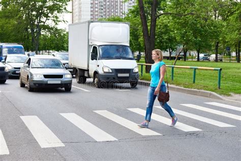 Woman Crossing The Street At Pedestrian Crossing Stock Photo Image Of