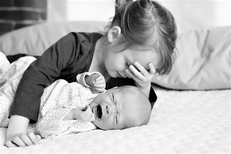 Crying New Born With Sibling Linden Photography Captures Big Sisters