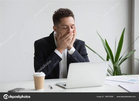 Tired Office Worker Yawning Working Long Hours — Stock Photo © Fizkes