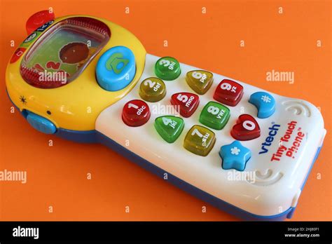 Vtech Toy Phone Isolated On An Orange Background Lancashire Uk 27 01