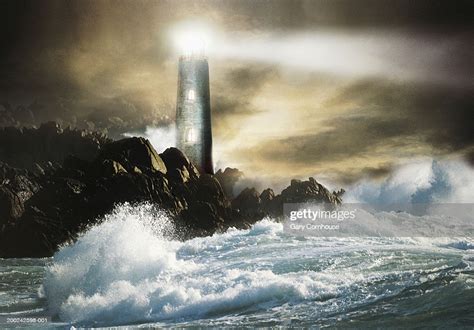 Lighthouse By Sea Night High Res Stock Photo Getty Images