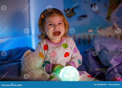 Little Toddler Girl Crying In Bed Tired Scared Child After Having