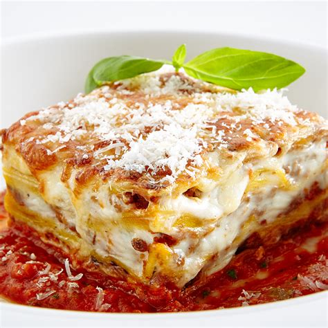 Remove lasagna from the oven and let it sit for at least 15 minutes before serving. Lasagna - Stadium Pizza