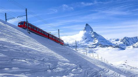 Matterhorn View With A Red Train Wallpaper Backiee